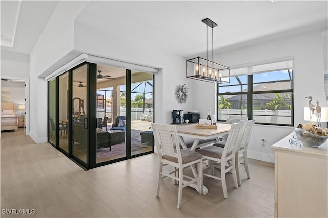 301 NW 36th Ave, Cape Coral, FL 33993 - dining room with light wood-style flooring and a chandelier
