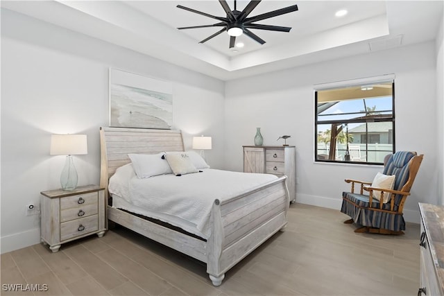 301 NW 36th Ave, Cape Coral, FL 33993 - bedroom featuring a raised ceiling, light wood-type flooring, recessed lighting, and ceiling fan