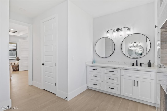 301 NW 36th Ave, Cape Coral, FL 33993 - bathroom featuring wood finished floors and vanity