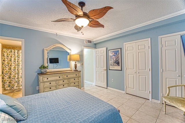 1900 Virginia Ave Unit 102, Fort Myers, FL 33901 - bedroom featuring light tile patterned floors, crown molding, a textured ceiling, a ceiling fan, and ensuite bathroom