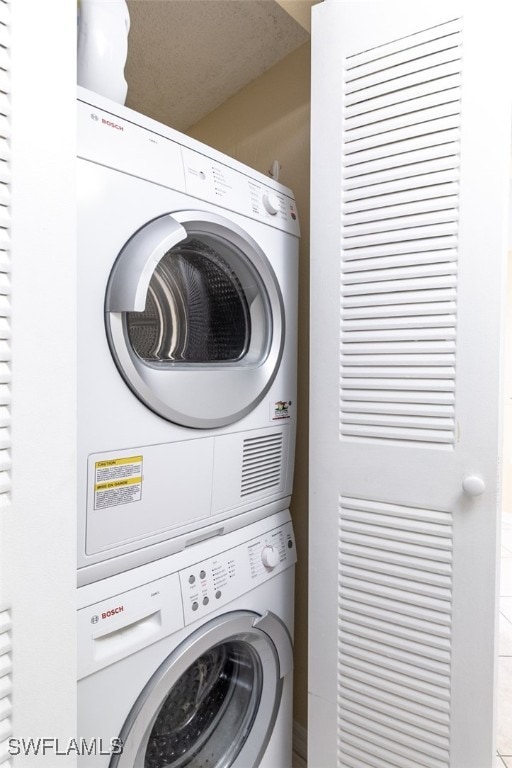 1900 Virginia Ave Unit 102, Fort Myers, FL 33901 - laundry room featuring stacked washer / drying machine