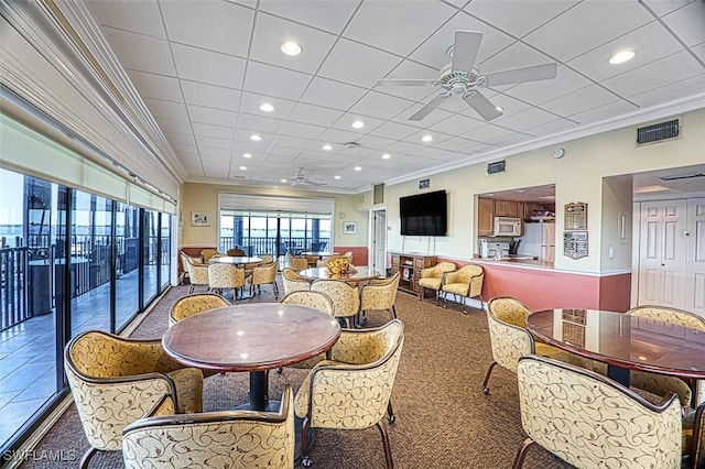 1900 Virginia Ave Unit 102, Fort Myers, FL 33901 - dining space featuring a ceiling fan, ornamental molding, recessed lighting, and carpet