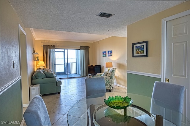 1900 Virginia Ave Unit 102, Fort Myers, FL 33901 - living area with a textured ceiling, tile patterned flooring, and ornamental molding