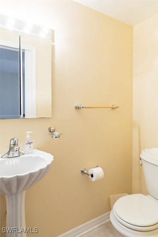 1900 Virginia Ave Unit 102, Fort Myers, FL 33901 - half bath with toilet and tile patterned floors