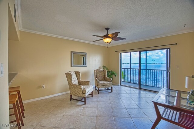 1900 Virginia Ave Unit 102, Fort Myers, FL 33901 - living area with crown molding, a ceiling fan, a textured ceiling, and light tile patterned floors