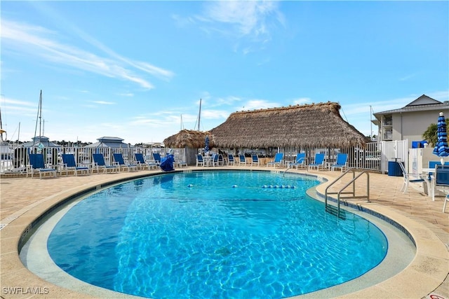 900 Broad Ave S Unit 320, Naples, FL 34102 - community pool featuring a patio area