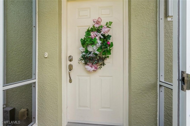 15029 Toscana Way, Naples, FL 34120 - property entrance featuring stucco siding