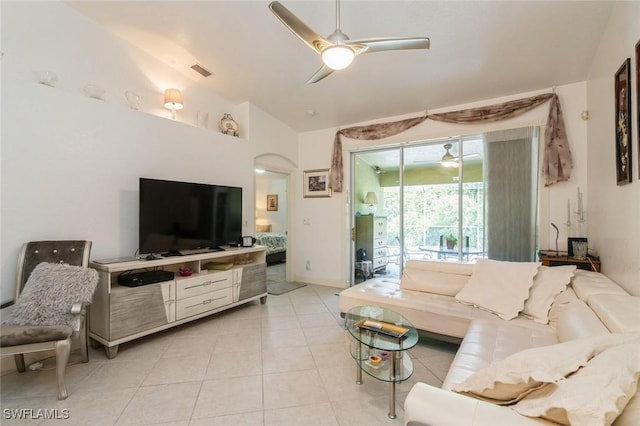 15029 Toscana Way, Naples, FL 34120 - living room with ceiling fan, light tile patterned floors, lofted ceiling, and arched walkways