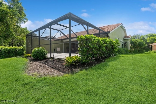 15029 Toscana Way, Naples, FL 34120 - rear view of house with a lawn, a patio area, a tiled roof, and a lanai