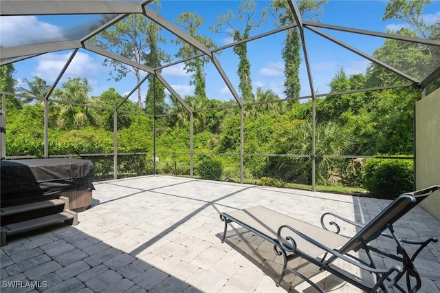 15029 Toscana Way, Naples, FL 34120 - view of patio / terrace with a hot tub, glass enclosure, and area for grilling