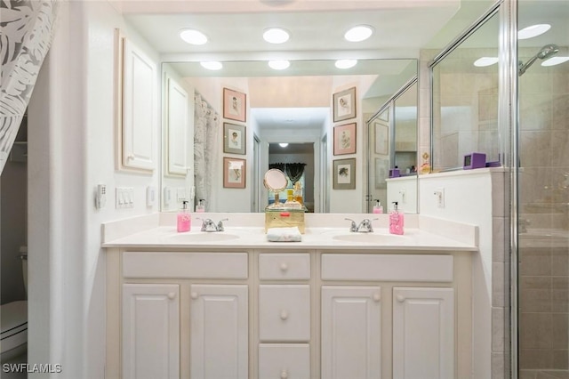 15029 Toscana Way, Naples, FL 34120 - bathroom with double vanity and a shower stall