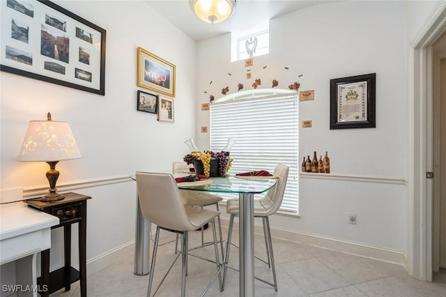15029 Toscana Way, Naples, FL 34120 - dining space featuring baseboards and light tile patterned floors