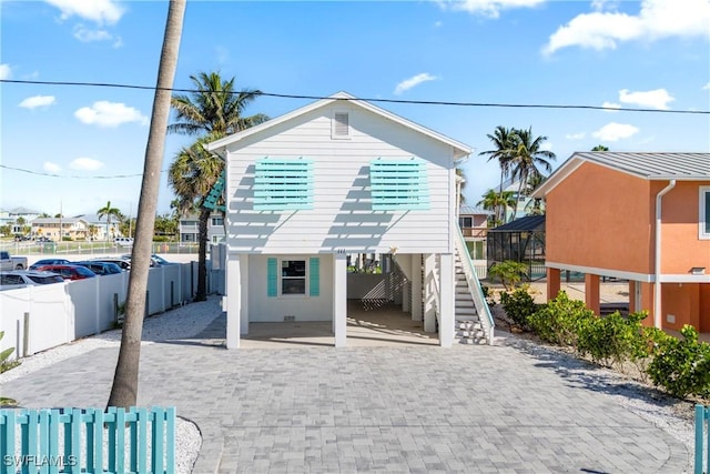 111 Bahia Via, Fort Myers Beach, FL 33931 - view of front of home featuring stairway and a carport