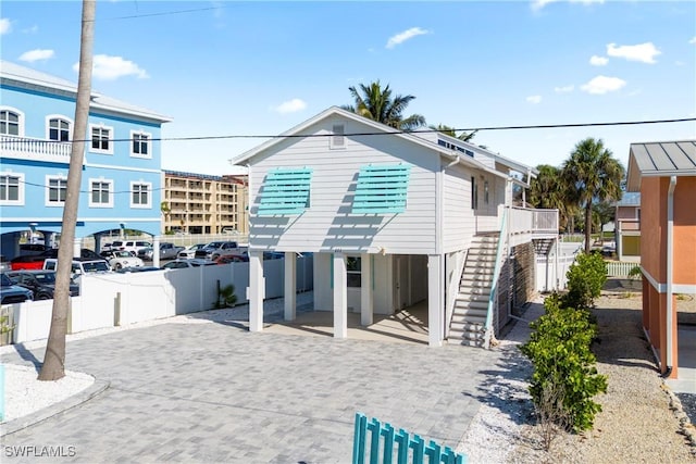 111 Bahia Via, Fort Myers Beach, FL 33931 - coastal inspired home featuring stairway and a carport