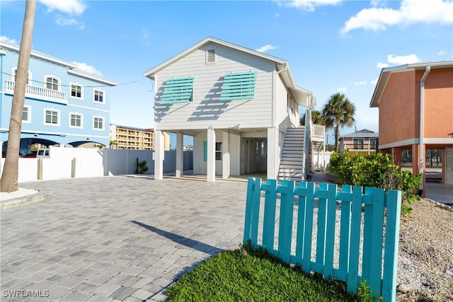111 Bahia Via, Fort Myers Beach, FL 33931 - coastal inspired home with a carport and stairway