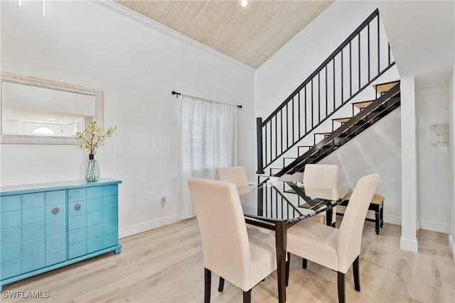 111 Bahia Via, Fort Myers Beach, FL 33931 - dining area with wood finished floors, high vaulted ceiling, stairs, wooden ceiling, and crown molding