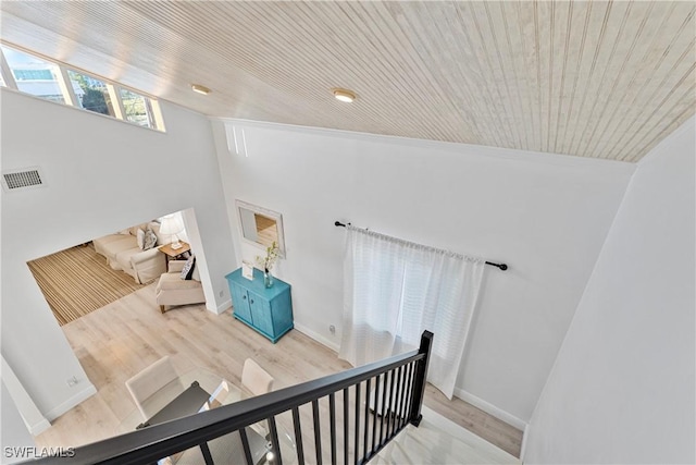 111 Bahia Via, Fort Myers Beach, FL 33931 - staircase featuring vaulted ceiling, wood finished floors, and wooden ceiling