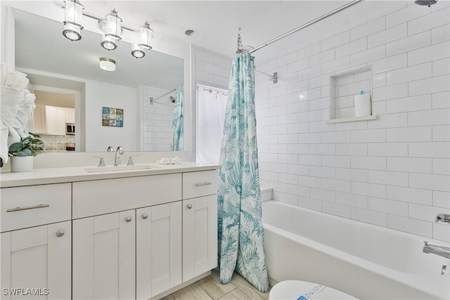111 Bahia Via, Fort Myers Beach, FL 33931 - bathroom featuring shower / bath combo with shower curtain, vanity, and tile patterned floors