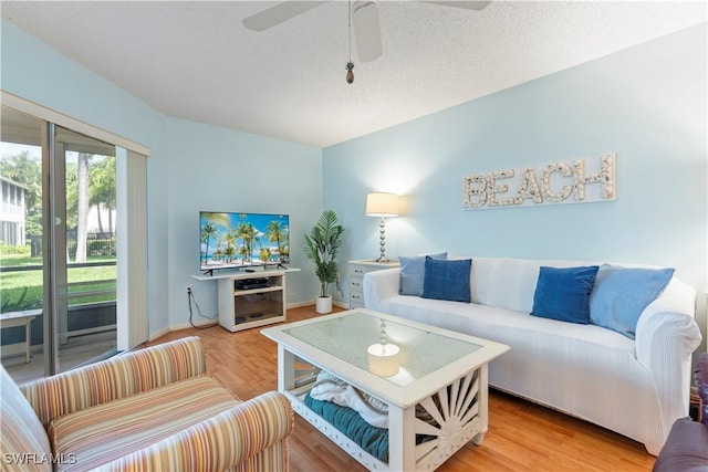 3200 Binnacle Dr Unit C1, Naples, FL 34103 - living area with a ceiling fan and light wood-style flooring
