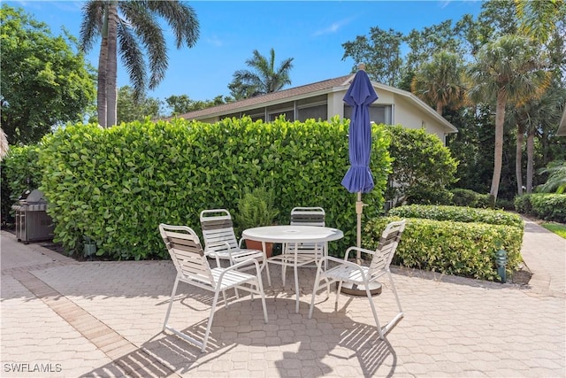 3200 Binnacle Dr Unit C1, Naples, FL 34103 - view of patio / terrace with outdoor dining space