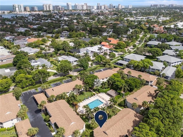 3200 Binnacle Dr Unit C1, Naples, FL 34103 - aerial view of property and surrounding area featuring skyline and a pool area
