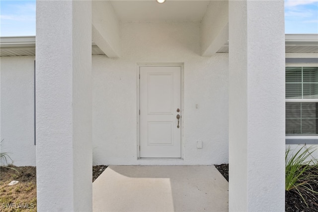 2801 50th St SW, Lehigh Acres, FL 33976 - property entrance featuring stucco siding