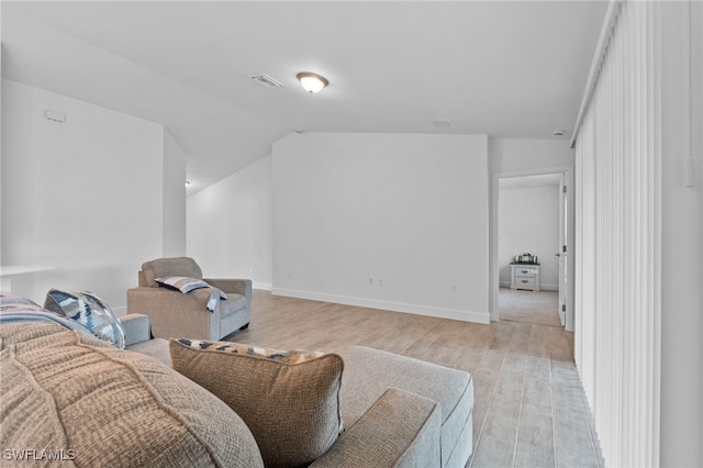 2801 50th St SW, Lehigh Acres, FL 33976 - living room featuring light wood-style floors and vaulted ceiling