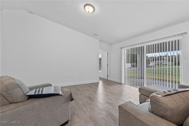 2801 50th St SW, Lehigh Acres, FL 33976 - living area featuring lofted ceiling and wood finished floors