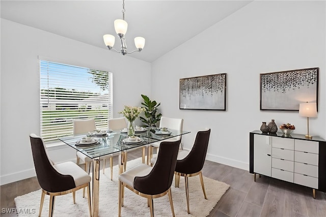 2801 50th St SW, Lehigh Acres, FL 33976 - dining room featuring a chandelier, lofted ceiling, and wood finished floors