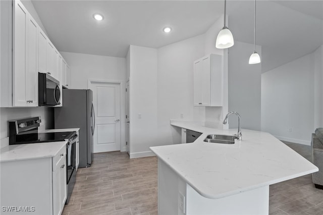2801 50th St SW, Lehigh Acres, FL 33976 - kitchen featuring stainless steel appliances, white cabinetry, a peninsula, light stone countertops, and light wood-style flooring