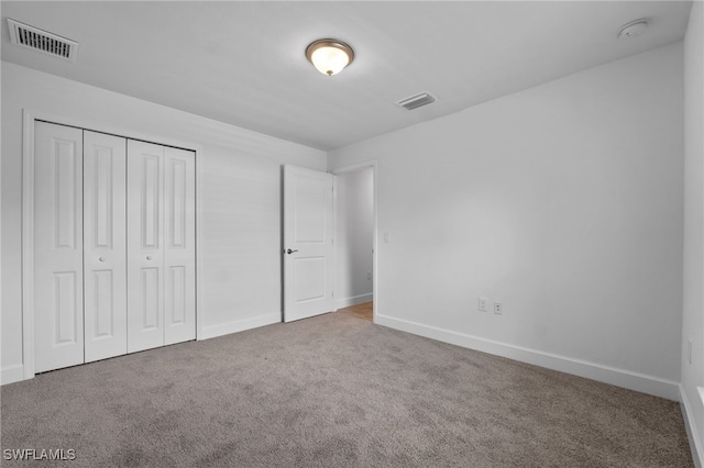 2801 50th St SW, Lehigh Acres, FL 33976 - unfurnished bedroom with carpet floors and a closet