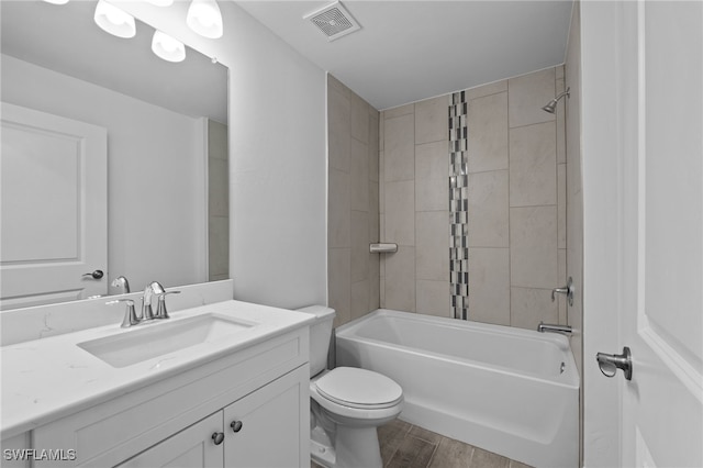 2801 50th St SW, Lehigh Acres, FL 33976 - full bathroom featuring vanity, wood finished floors, and tub / shower combination