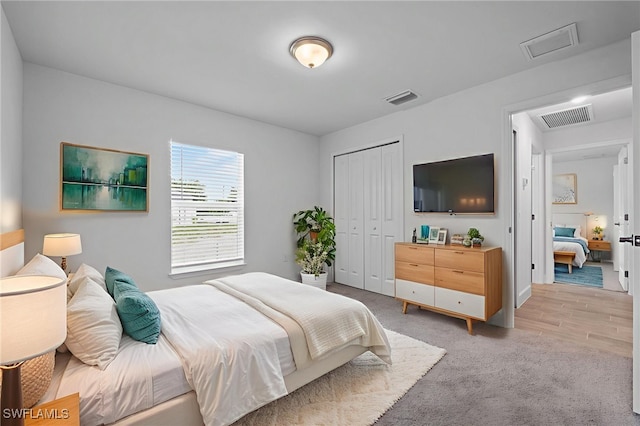 2801 50th St SW, Lehigh Acres, FL 33976 - bedroom featuring light carpet, a closet, and attic access
