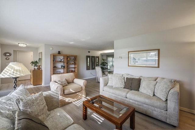 5034 Westminster Dr, Fort Myers, FL 33919 - living area featuring baseboards and light wood-type flooring