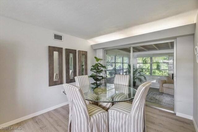 5034 Westminster Dr, Fort Myers, FL 33919 - dining room featuring baseboards and wood finished floors