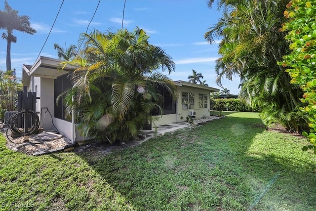5034 Westminster Dr, Fort Myers, FL 33919 - view of home's exterior featuring a lawn and stucco siding