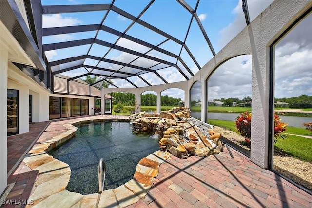 8060 Glenfinnan Cir, Fort Myers, FL 33912 - outdoor pool featuring a patio, a water view, and glass enclosure