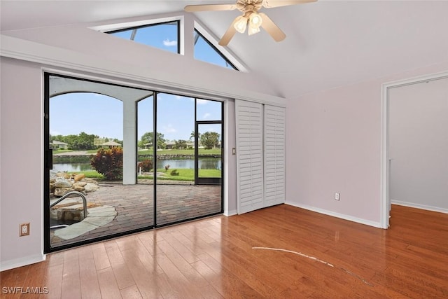8060 Glenfinnan Cir, Fort Myers, FL 33912 - unfurnished room featuring a water view, lofted ceiling, wood finished floors, and ceiling fan