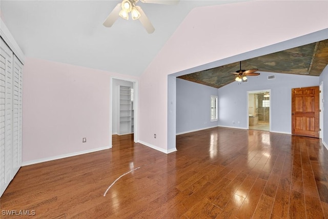 8060 Glenfinnan Cir, Fort Myers, FL 33912 - unfurnished living room featuring ceiling fan, lofted ceiling, and wood finished floors
