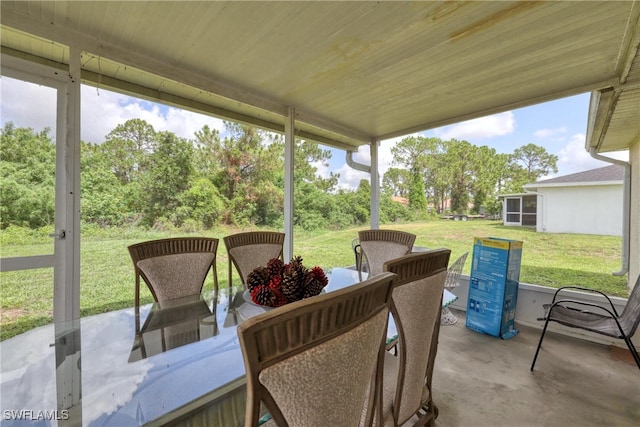 936-938 Eisenhower Blvd, Lehigh Acres, FL 33974 - view of patio with view of wooded area