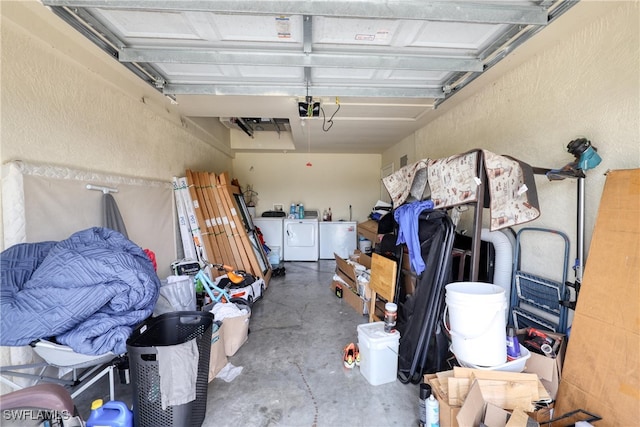 936-938 Eisenhower Blvd, Lehigh Acres, FL 33974 - garage featuring independent washer and dryer, a garage door opener, and a textured wall