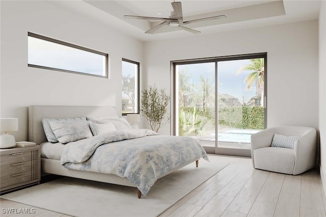 101 Beachcomber St, Marco Island, FL 34145 - bedroom with access to exterior, a raised ceiling, light wood finished floors, and a ceiling fan