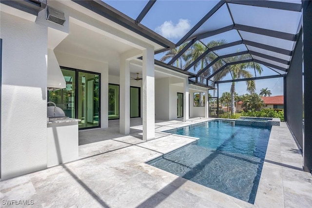 101 Beachcomber St, Marco Island, FL 34145 - view of pool with an outdoor kitchen, ceiling fan, a patio, and glass enclosure