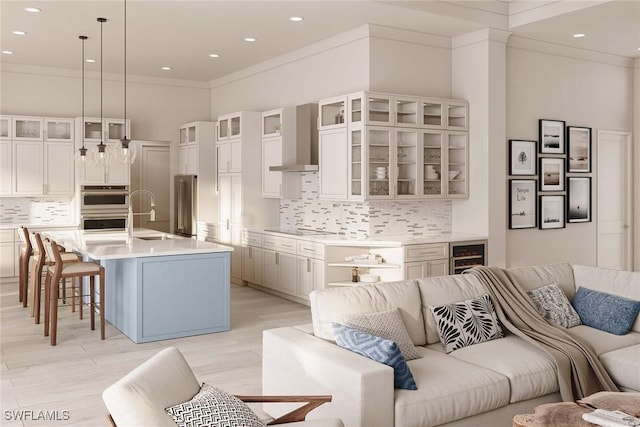 101 Beachcomber St, Marco Island, FL 34145 - living room featuring wine cooler, crown molding, and recessed lighting