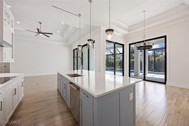 101 Beachcomber St, Marco Island, FL 34145 - kitchen featuring a tray ceiling, stainless steel dishwasher, ornamental molding, a ceiling fan, and gray cabinets