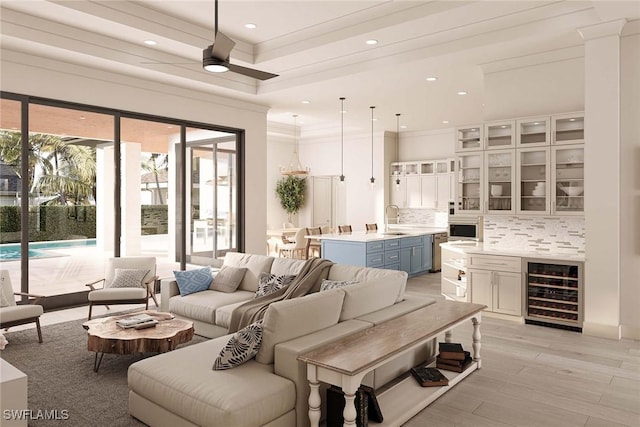 101 Beachcomber St, Marco Island, FL 34145 - living room with beverage cooler, crown molding, recessed lighting, light wood finished floors, and ceiling fan