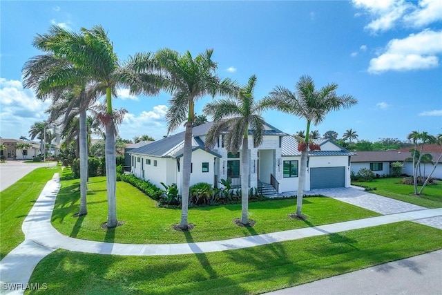 101 Beachcomber St, Marco Island, FL 34145 - view of front facade featuring a garage, a front lawn, and stucco siding