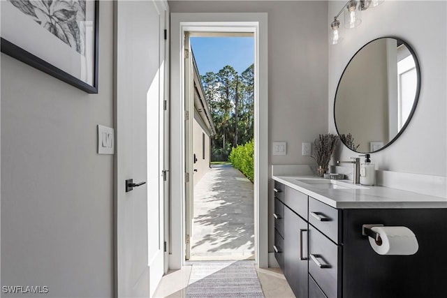 240 Allamanda Way, Naples, FL 34114 - bathroom with vanity and tile patterned floors