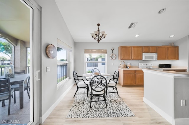 9636 Hemingway Ln Unit 4201, Fort Myers, FL 33913 - dining area with a chandelier, light wood finished floors, lofted ceiling, and recessed lighting