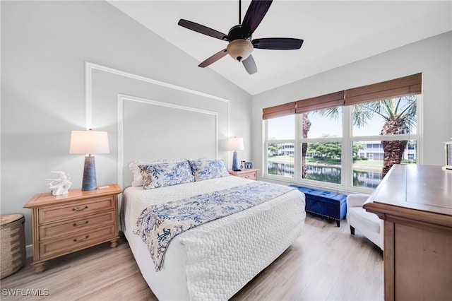 9636 Hemingway Ln Unit 4201, Fort Myers, FL 33913 - bedroom featuring vaulted ceiling, light wood-style flooring, ceiling fan, and a water view